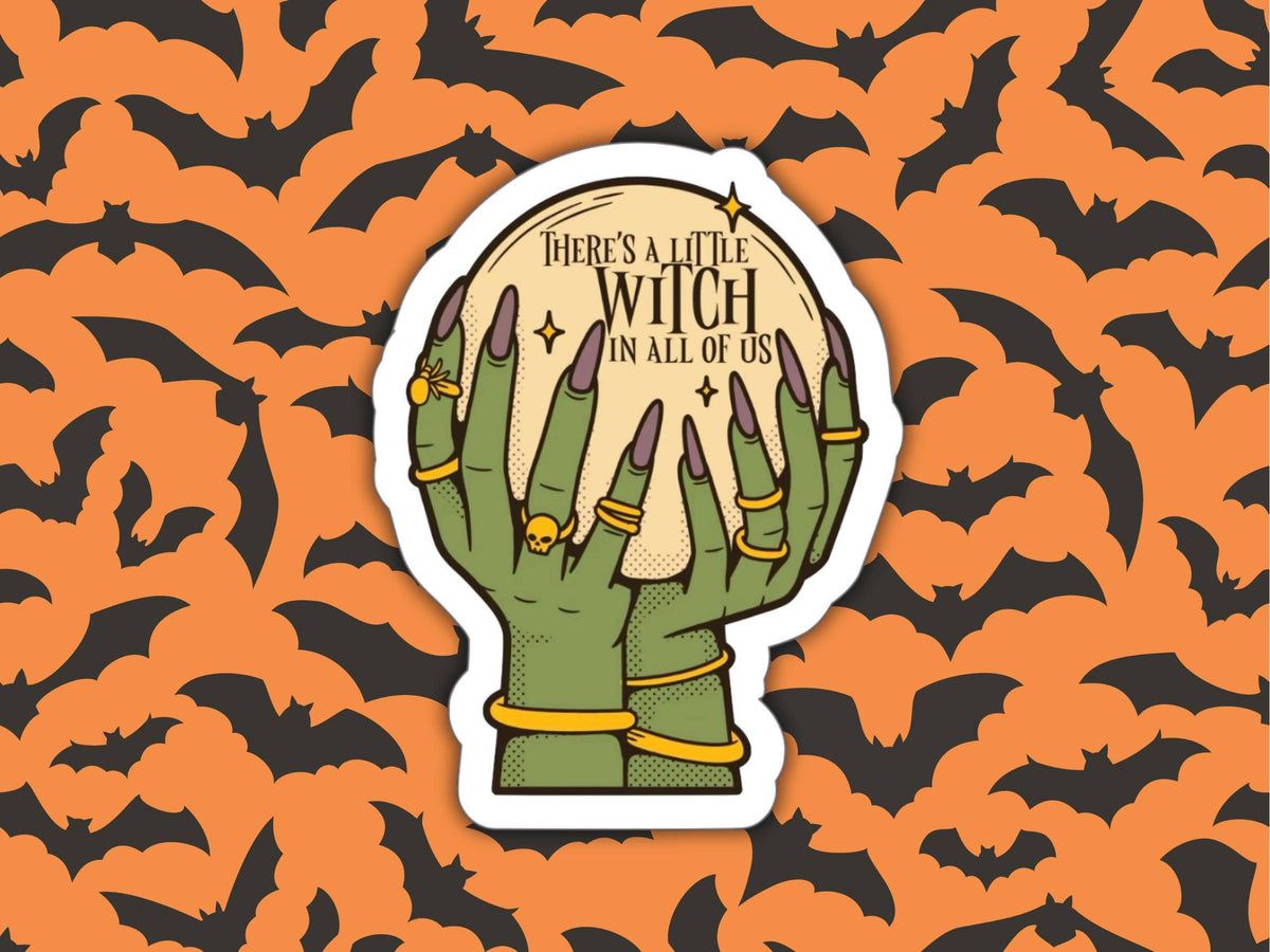 A die-cut sticker featuring two green skeletal hands holding a glowing moon with the text &