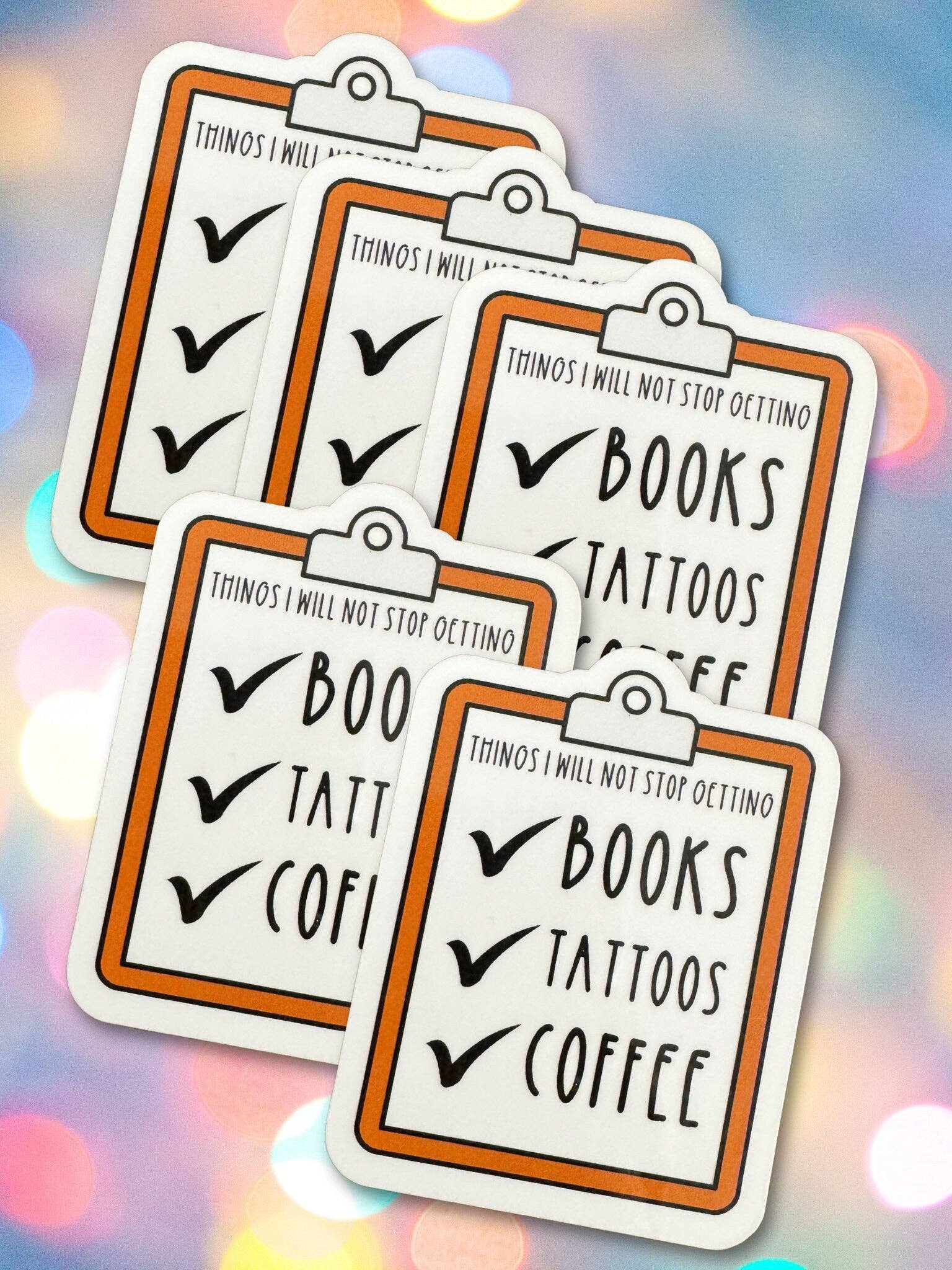 Set of five clipboard-style stickers with text on a colorful blurred background