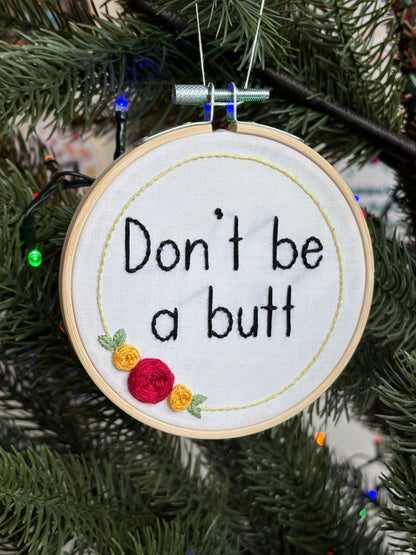 Embroidery hoop reads, "Don&