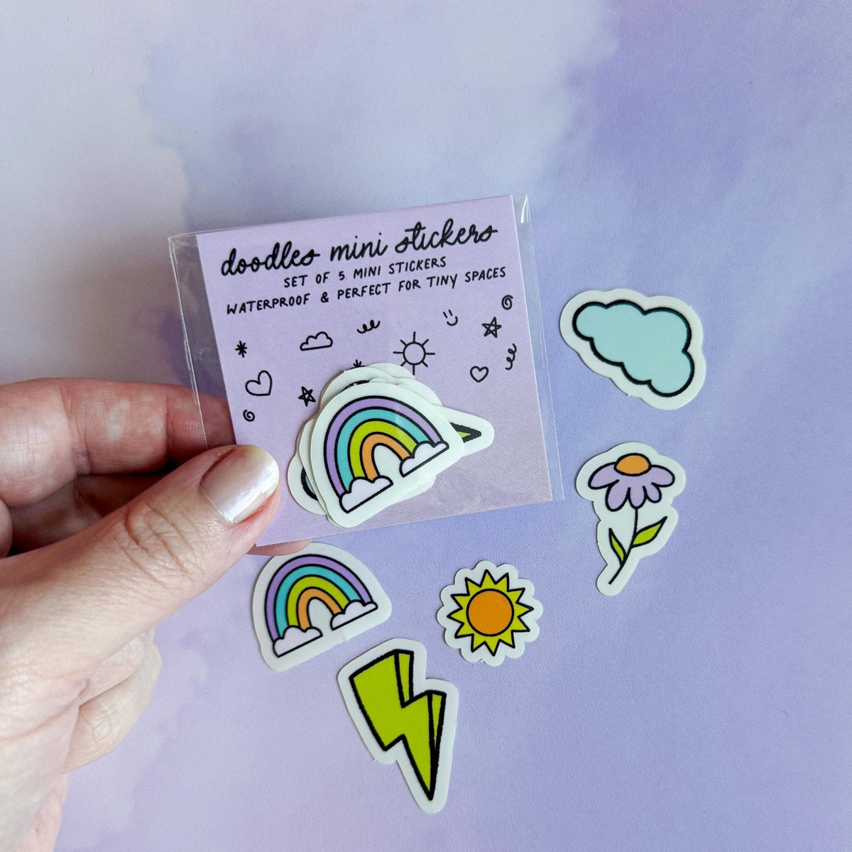 Doodles mini sticker set - lightning bolt, cloud, rainbow, flower, sun detail — close up of the rainbow and cloud doodles by indie artist MangoIllustrated