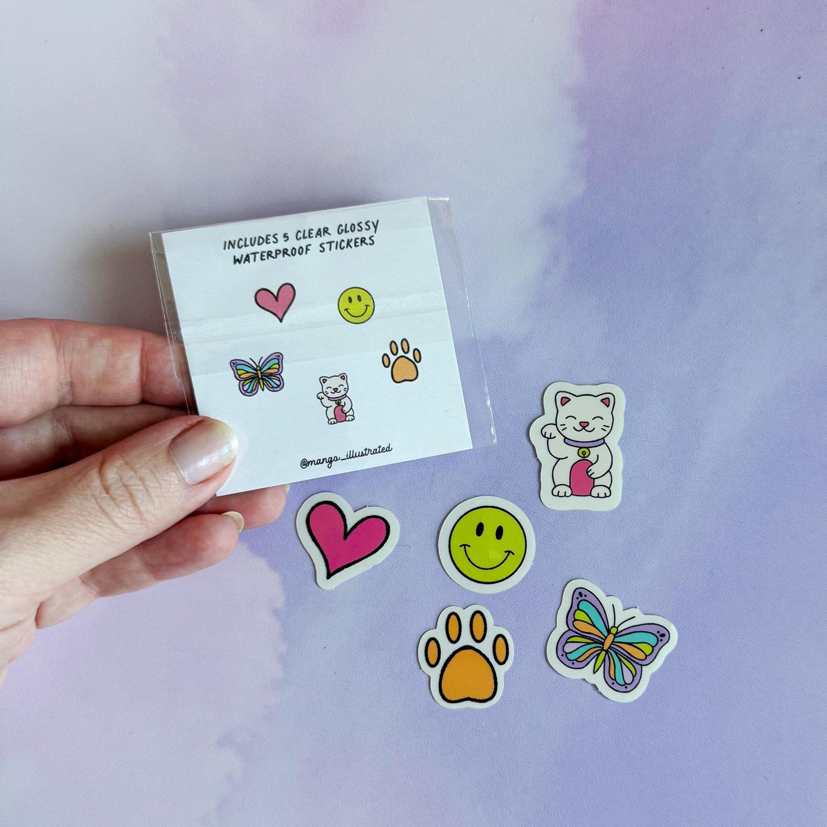 Doodles mini sticker set - lucky cat, smile, butterfly, paw, heart on a journal — small spot stickers by indie artist MangoIllustrated