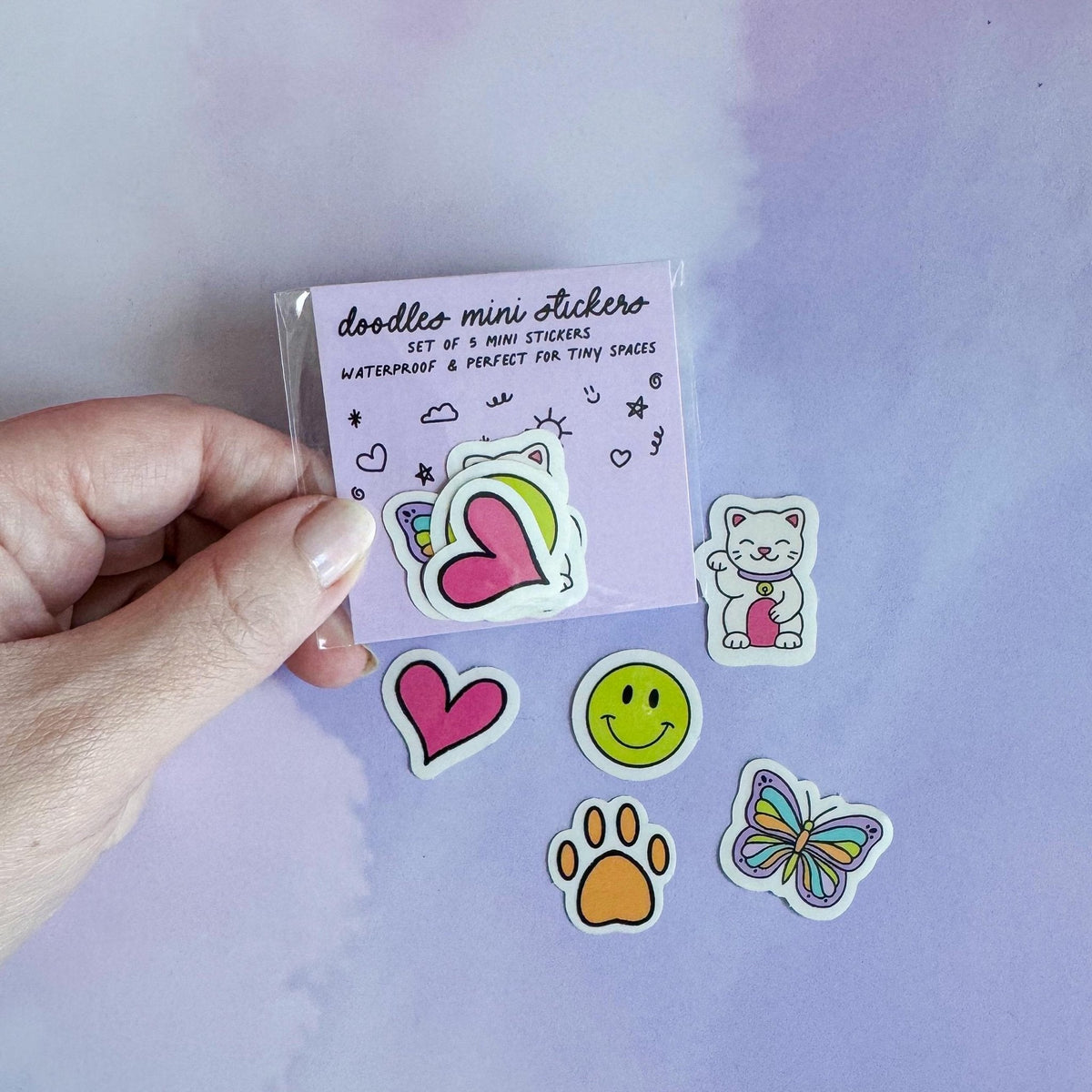Doodles mini sticker set - lucky cat, smile, butterfly, paw, heart detail — close up of the lucky cat doodle by indie artist MangoIllustrated