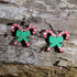 Hand-painted wooden crossed candy cane dangle earrings featuring two festive red and white candy canes tied together with a bright green holiday bow. Crafted from lightweight wood with hypoallergenic .925 sterling silver hooks, these cheerful Christmas earrings are perfect for holiday parties, Christmas celebrations, winter festivals, stocking stuffers, cookie exchanges, and anyone who loves classic Christmas candy and festive holiday jewelry.
