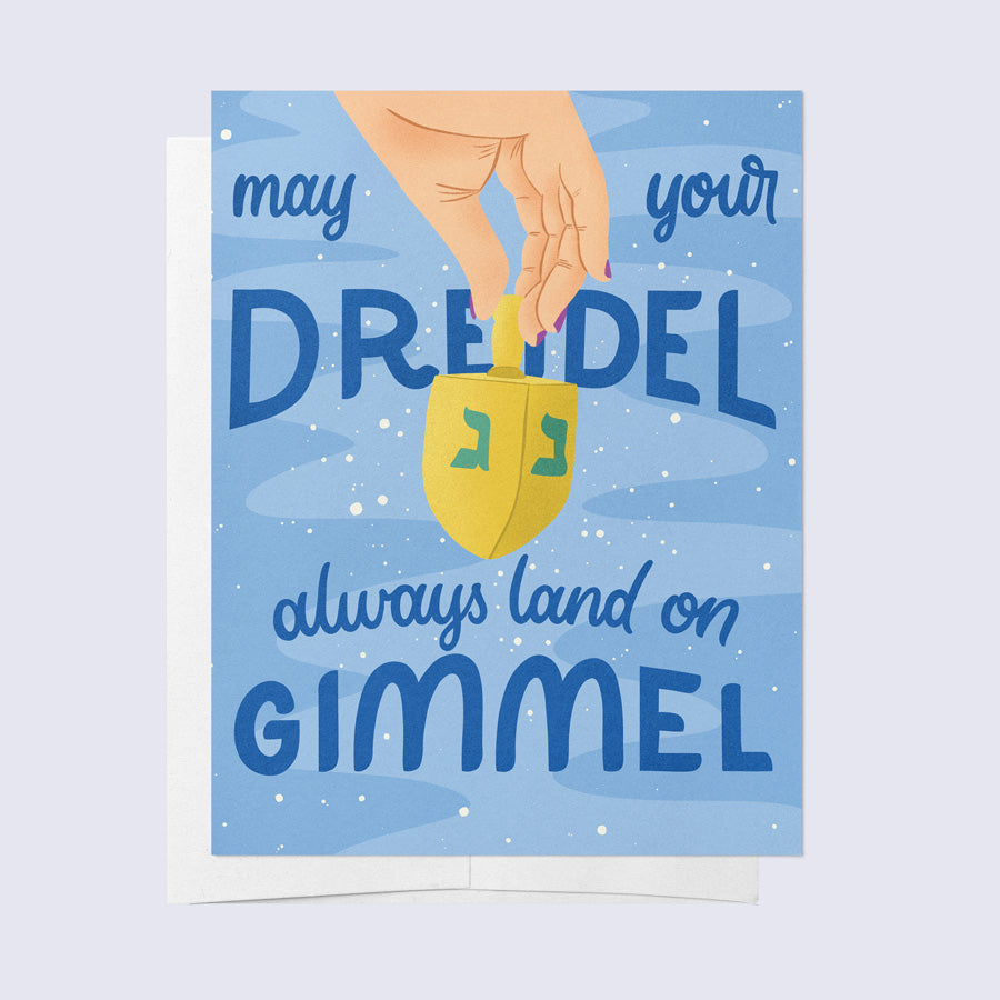 A greeting card with a blue background featuring a graphic of a dreidel and the text &
