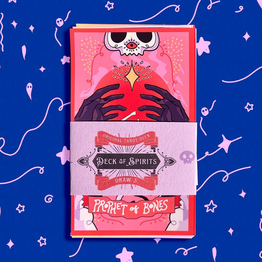 A boxed tarot deck wrapped in a paper sleeve labeled &