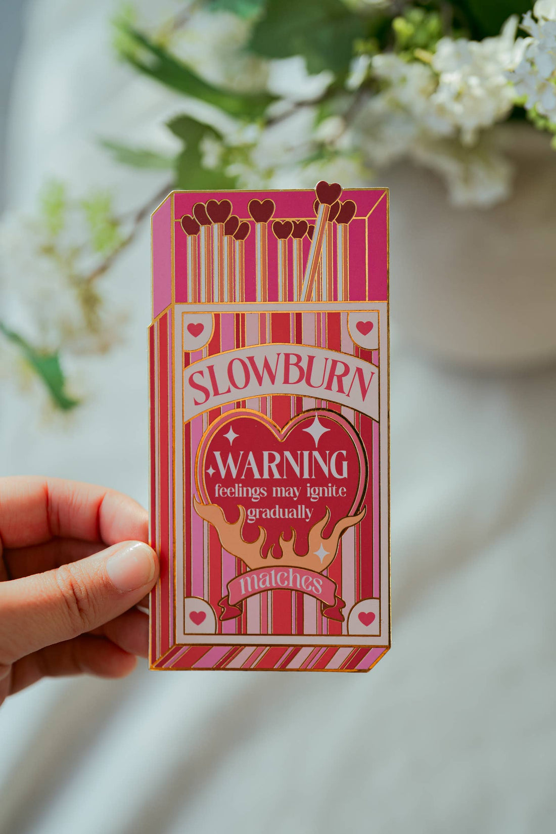 Pink matchbox-shaped bookmark labeled &
