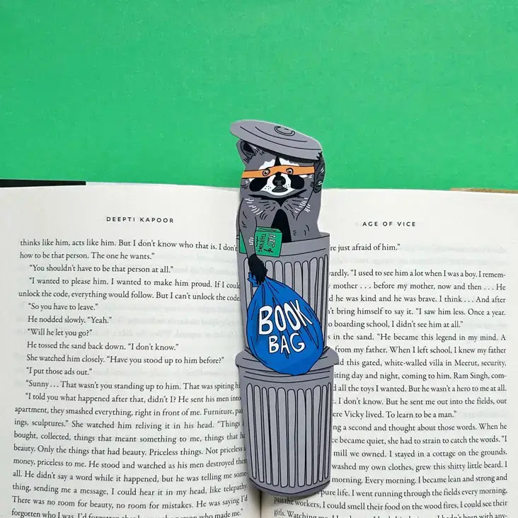 Bookmark shaped like a raccoon in a trash can with a &