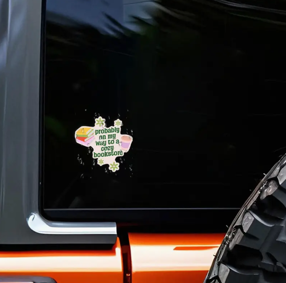 Sticker on a car window with text &