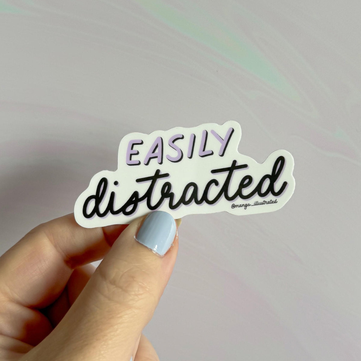 Easily distracted sticker alternate view — weatherproof vinyl neurodivergent sticker for planners and journals by indie artist MangoIllustrated
