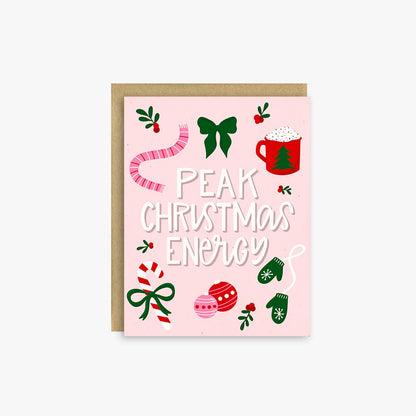 A pink Christmas greeting card with the phrase &