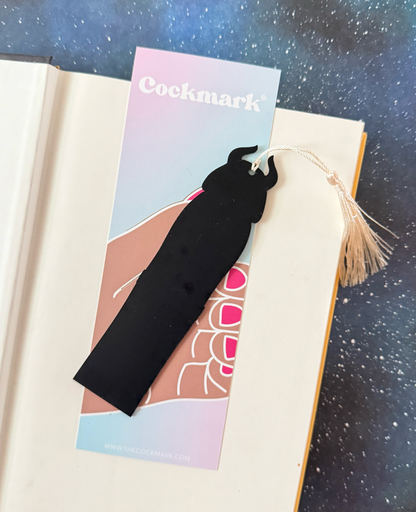 Black tassel bookmark on a colorful card with &