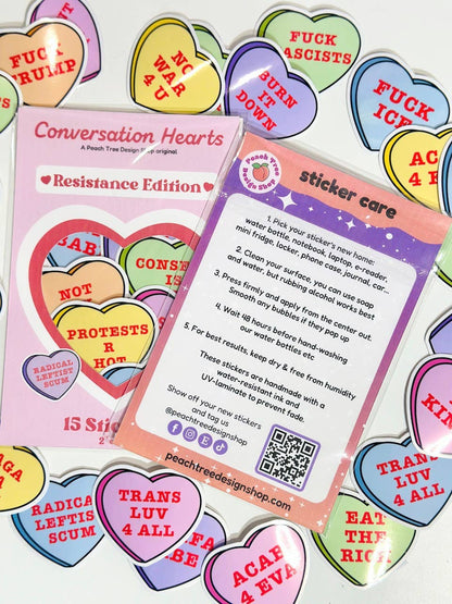 Colorful heart-shaped stickers with text and a &