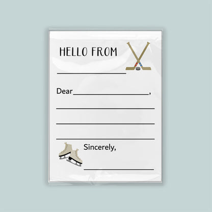 The image is a white envelope with a hockey stick and skates on the front, along with a blank greeting card space for a message.