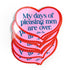 Stack of heart-shaped pink coasters with blue text on a white background