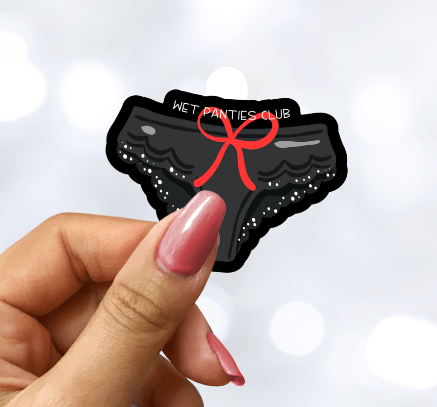 Sticker of black panties with a red bow held by a hand against a light background