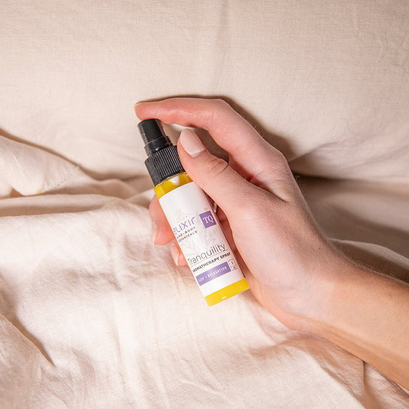 Use Elixir Mind Body Botanicals Aromatherapy Spray to scent your bed linens. Available at Elixir Mind Body Boutique