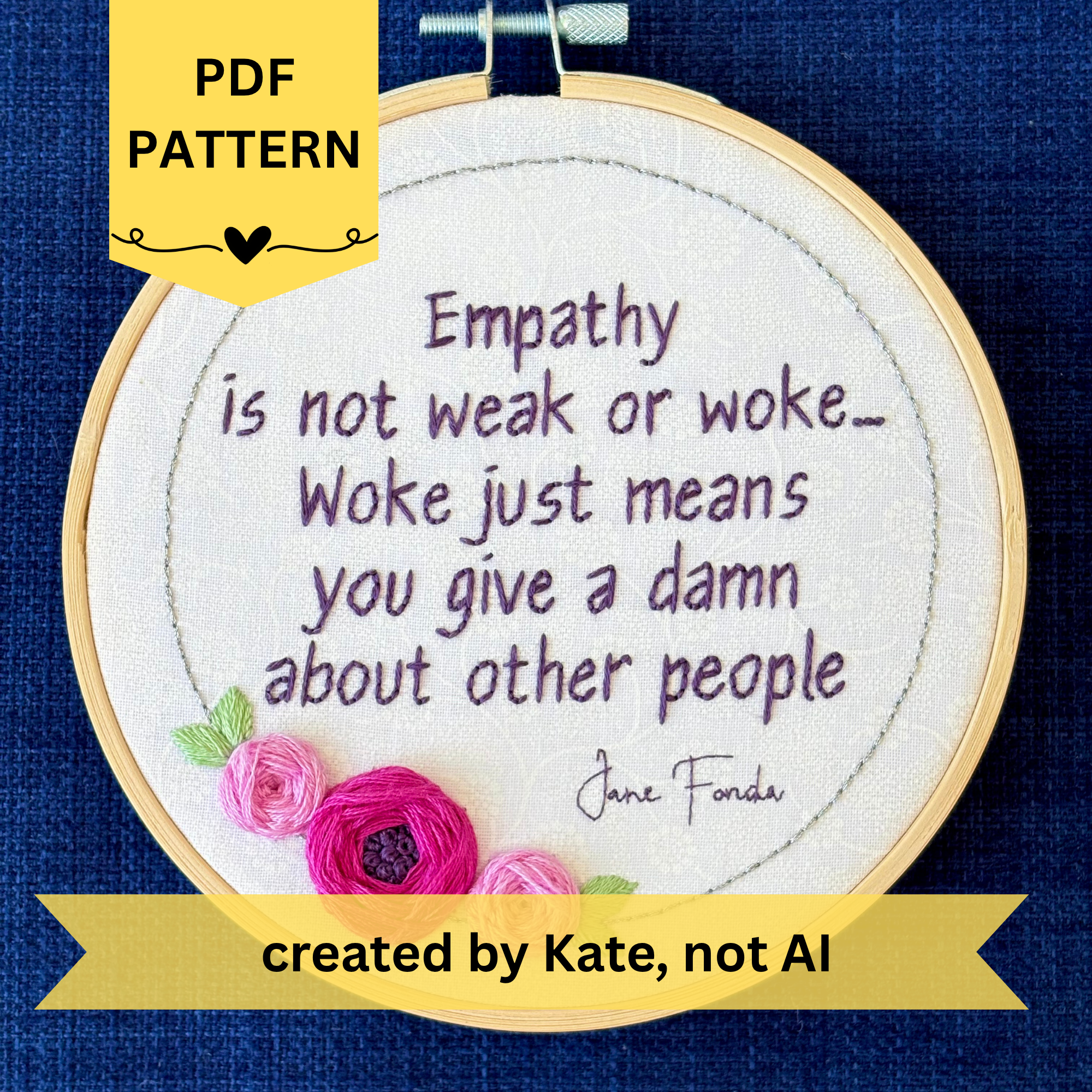 PDF pattern created by Kate, not AI. "Empathy is not weak or work...Woke just means you give a damn about other people. Jane Fonda." Quote hand embroidered in dark purple. Framed in silver circle floral wreath with bright fuchsia and pink roses and light green leaves. Hand stitched on white-on-white cotton. Displayed as fan wall art in light wood embroidery hoop.