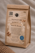 A kraft paper stand-up coffee bag labeled &