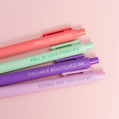 Set of colorful pens with motivational text on a pink background
