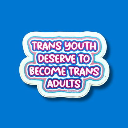 A die-cut sticker with the text &