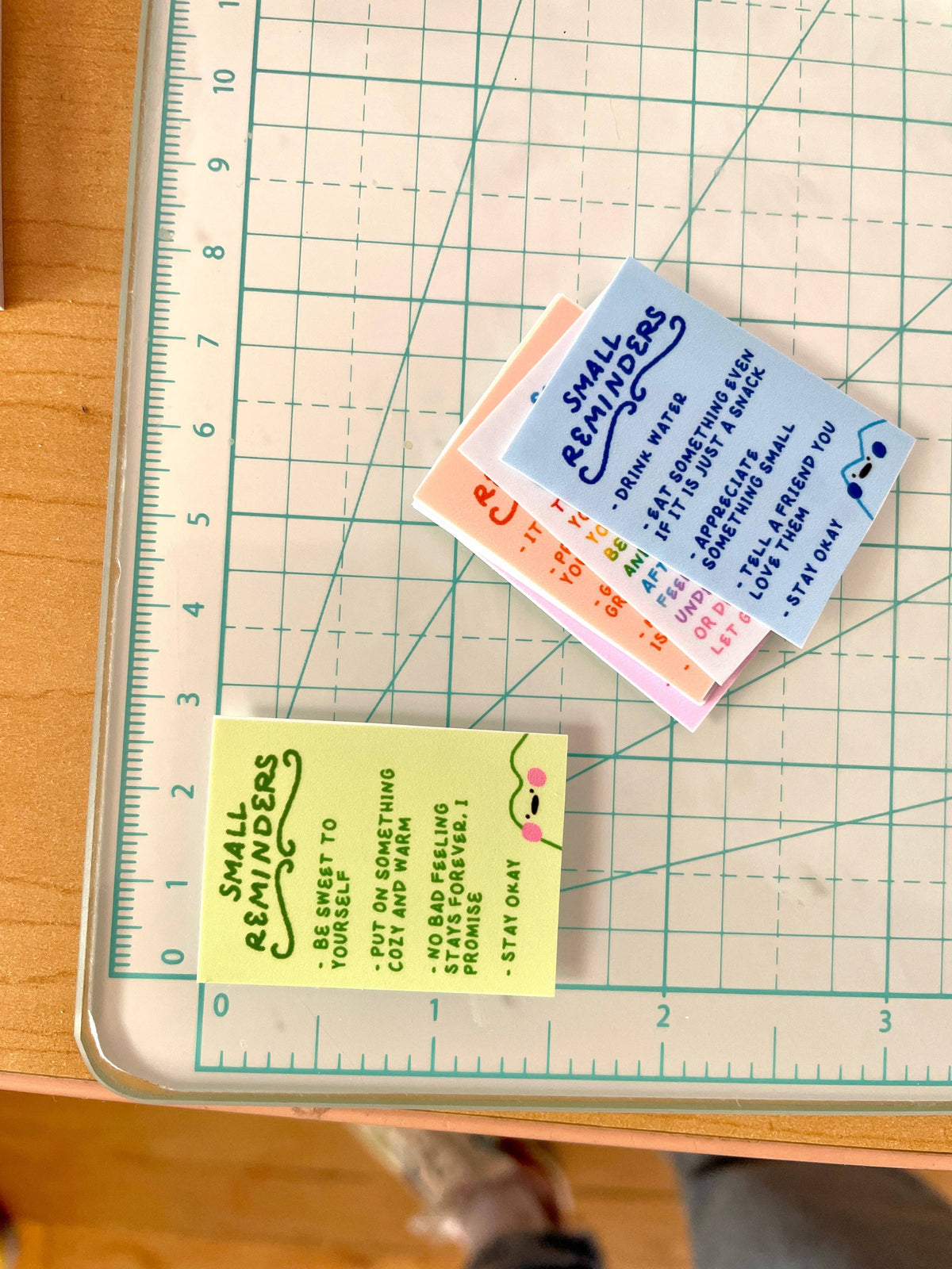 Small reminder notes on a cutting mat with a ruler for scale