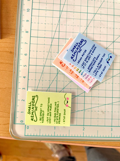 Small reminder notes on a cutting mat with a ruler for scale