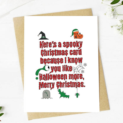 A white Christmas greeting card with red text reading &