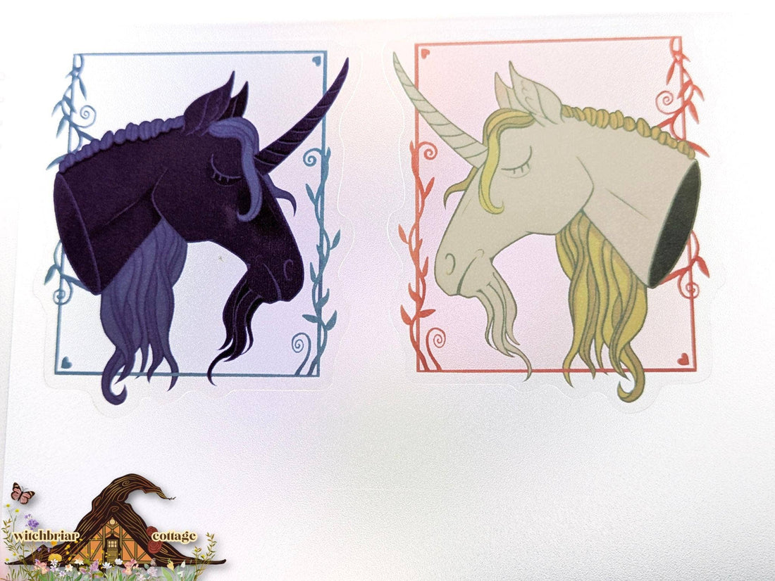 Two stylized unicorn heads with decorative frames on a white background.