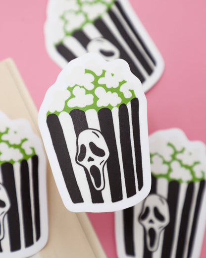 Stickers with black and white striped design and ghost face on a pink background