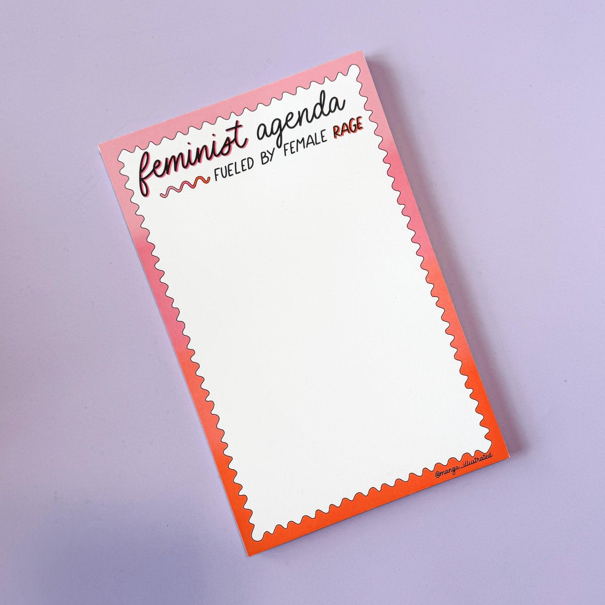 Feminist agenda notepad flat lay — 8.5 x 5.5 inch gummed to-do list pad styled on a desk by indie artist MangoIllustrated