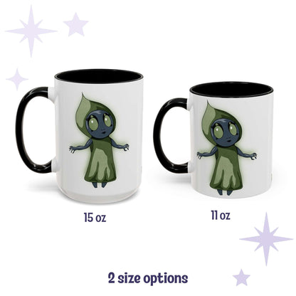 Chibi Flatwoods Monster cryptid mug shown in 15 oz and 11 oz, white ceramic with black interior and handle