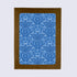 A folded greeting card with a blue floral menorah pattern, paired with a white envelope.