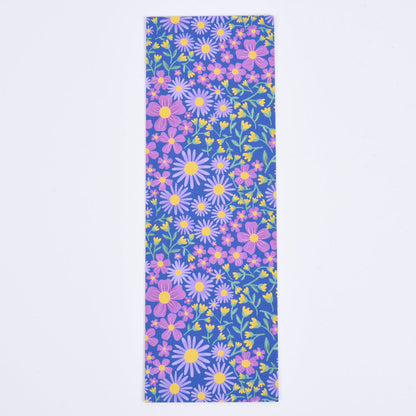 A bookmark with a floral pattern featuring blue and purple flowers on a blue background.