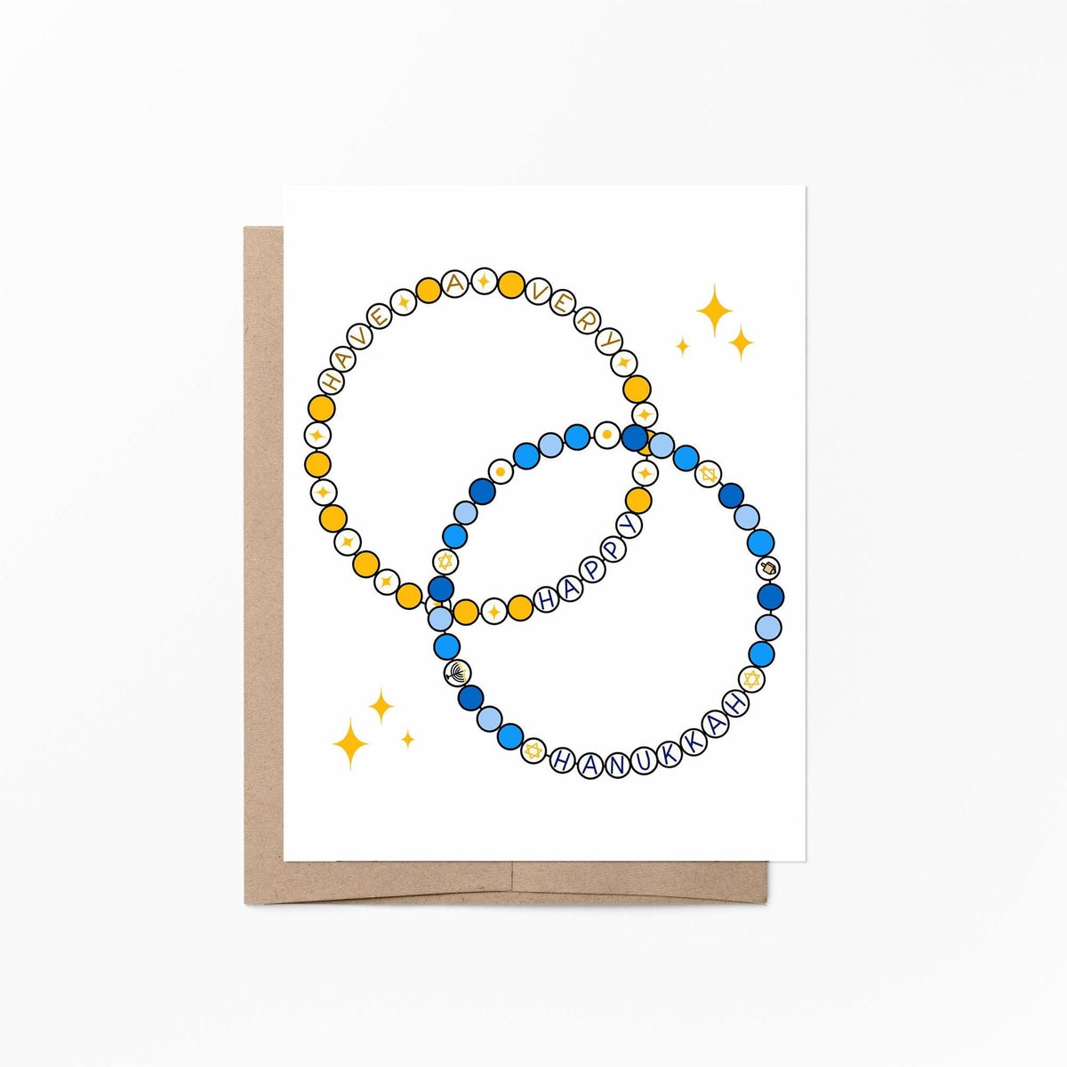 Friendship bracelet Hanukkah card flat lay — friendship bracelet Hanukkah card styled with blue and gold decor, by indie artist MangoIllustrated
