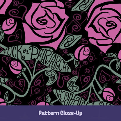 Close-up of dark floral wrap-print mug design — large fuchsia roses with Art Nouveau foliage and hand-lettered Fuck the Patriarchy in calligraphic ribbon banners on black background