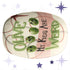 Funny retro serving platter with mid-century modern olive illustration reading Olive My Kids Are Weird, featuring four anthropomorphic green olive characters with expressive lashed eyes on a cream and dusty rose ground with atomic starburst motif