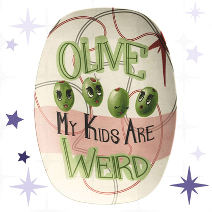 Funny retro serving platter with mid-century modern olive illustration reading Olive My Kids Are Weird, featuring four anthropomorphic green olive characters with expressive lashed eyes on a cream and dusty rose ground with atomic starburst motif