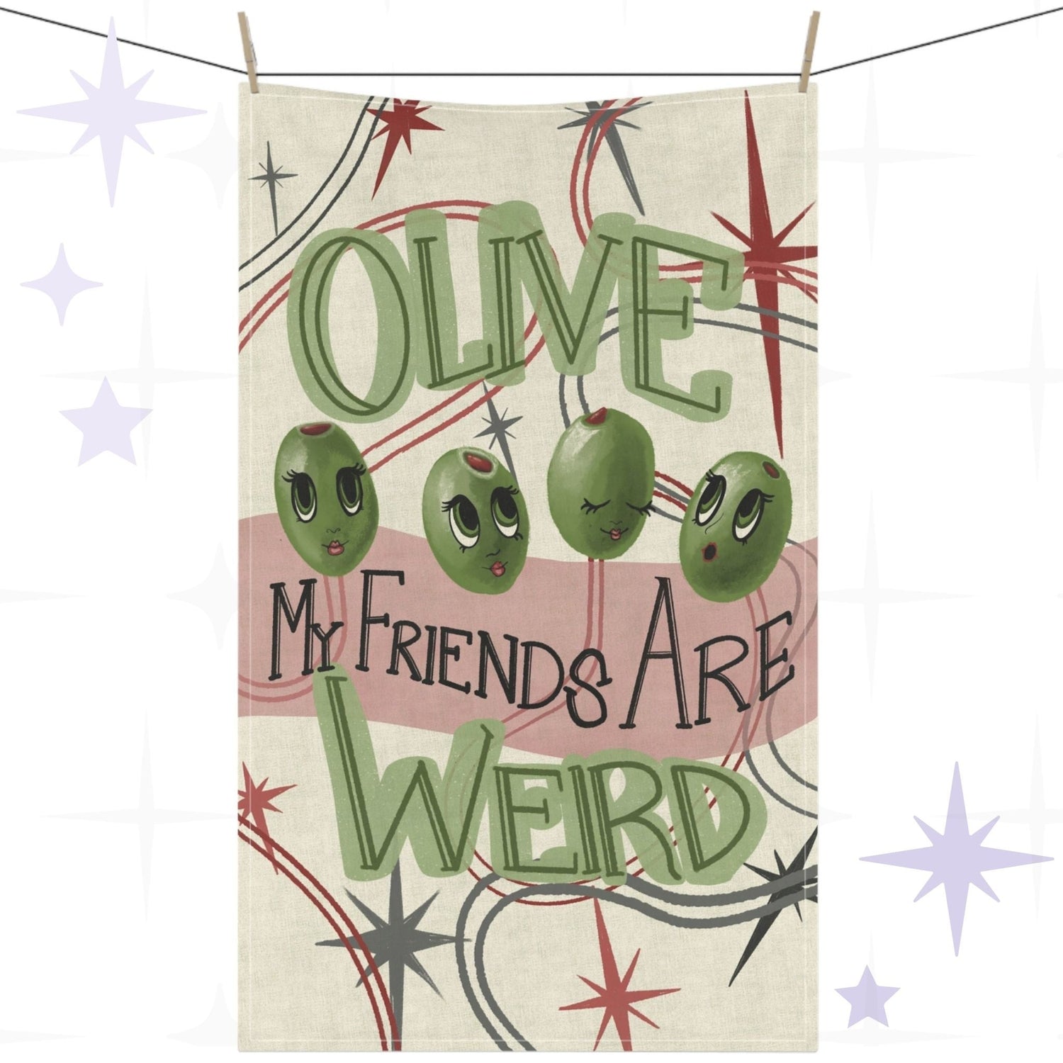 Funny tea towel with retro mid-century olive illustration and hand-lettered pun reading "Olive my friends are weird," hung on a clothesline against a white background