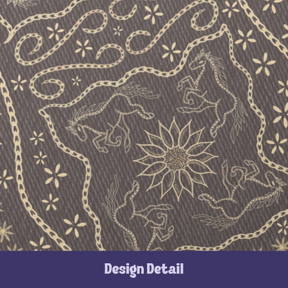 Design detail showing two hand-drawn galloping horses flanking a sunburst medallion with chain-stitch scrollwork on taupe softcover journal
