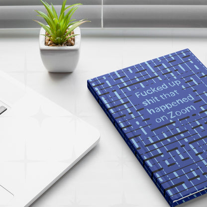 Zoom meeting profanity journal on white desk next to laptop and small succulent plant, work from home lifestyle setting