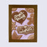 A greeting card with a gingerbread man design, along with stars, hearts, and text that reads &