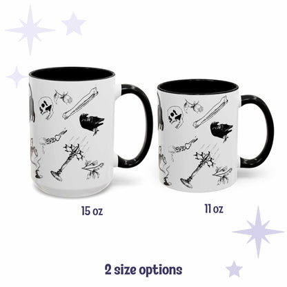 Black and white gothic pattern mugs in 15 oz and 11 oz sizes with scattered bones, skull, and raven