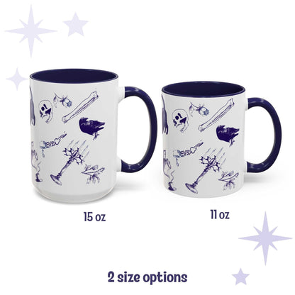 Blue and white delft pattern mugs in 15 oz and 11 oz sizes with scattered bones, skull, and raven