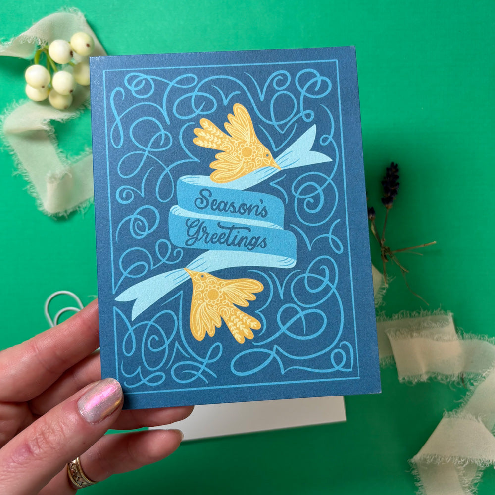 Blue greeting card with gold birds and &