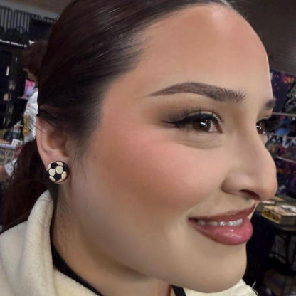 Close-up lifestyle photo showcasing the lightweight fit and everyday size of the hand-painted wooden soccer ball stud earrings. Worn with casual attire to highlight their sporty style and comfortable all-day wear.