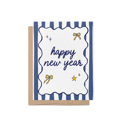 Happy New Year greeting card with navy blue text, gold bow and star illustrations, and bold navy and white stripes. Includes kraft envelope.