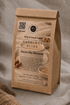 A kraft paper coffee bag labeled &