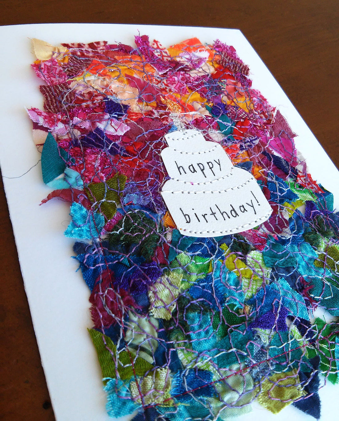 Birthday cake card: 5" x 7", multicolored fabric collage on white, blank inside, with matching envelope