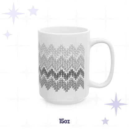 White ceramic 15oz coffee mug with gray to charcoal fair isle zigzag pattern made from hidden profanity in cross-stitch lettering
