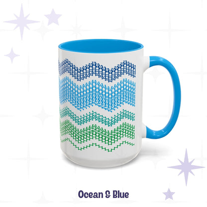 Ocean &amp; Blue hidden message coffee mug, 15oz, side view — white ceramic with blue handle and interior, four chevron bands in navy, cornflower blue, teal, and kelly green